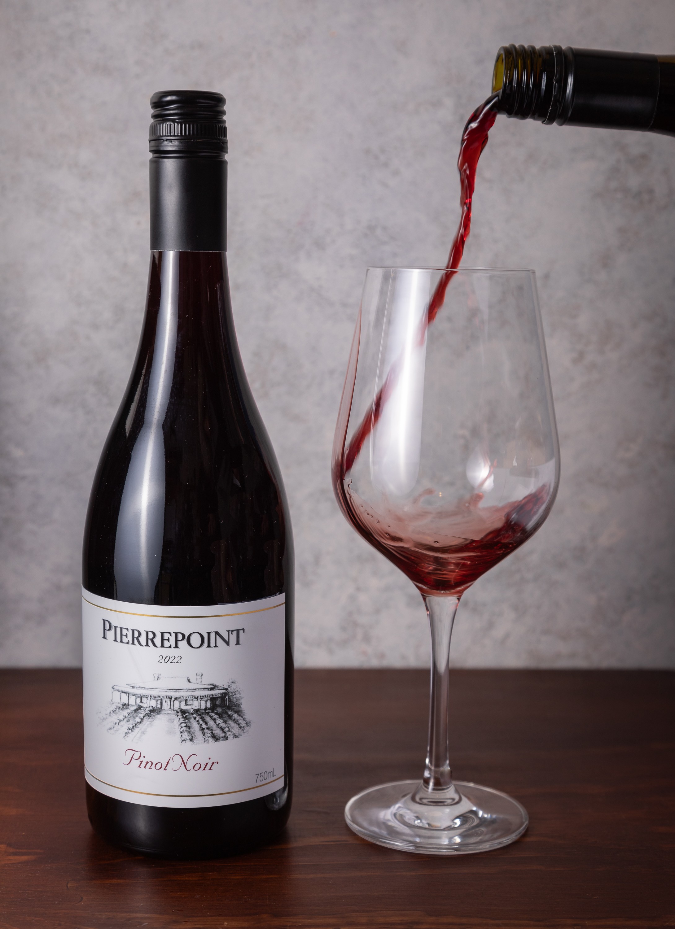 Pierrepoint Wines Pinot Noir photographed with glass being poured private project of Steve Wickenton